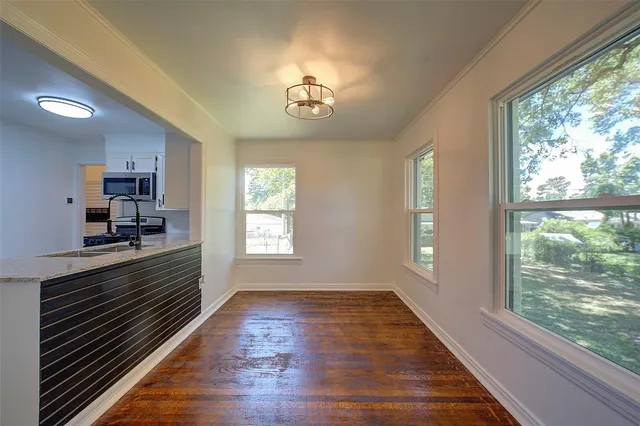 a view of an entryway with wooden floor
