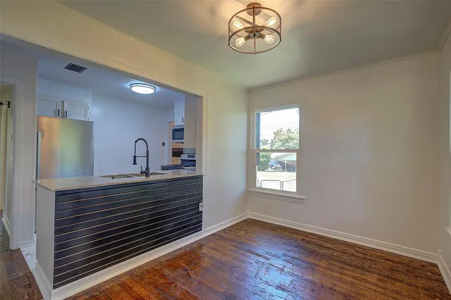 a view of a kitchen with a dishwasher cabinets and a window