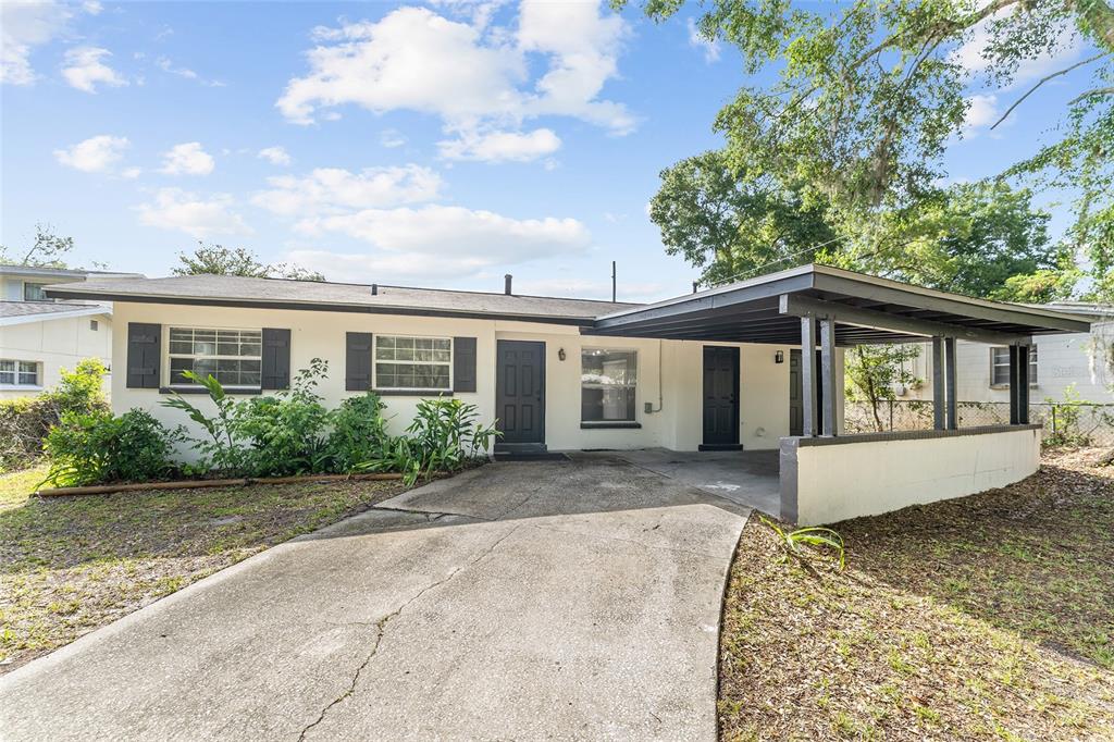 919 Southeast 19th Street Gainesville, FL 32641 - Photo 1 of 50 a front view of a house with a garden
