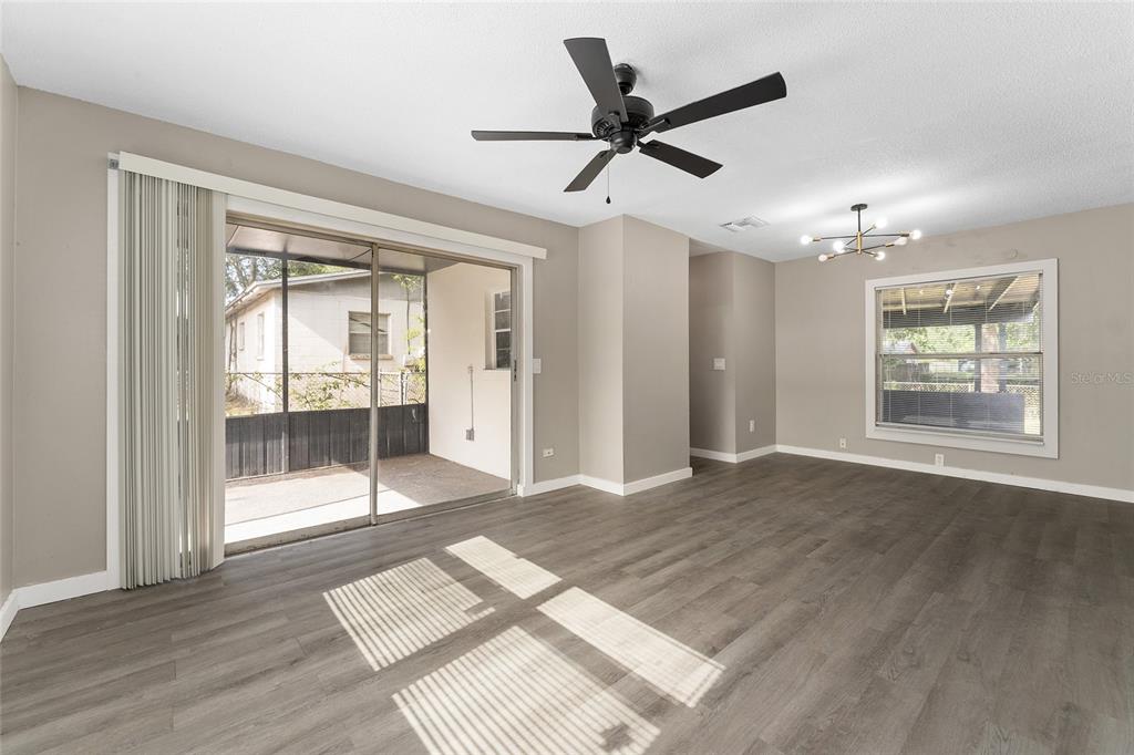 919 Southeast 19th Street Gainesville, FL 32641 - Photo 12 of 50 a view of a livingroom with a ceiling fan and window