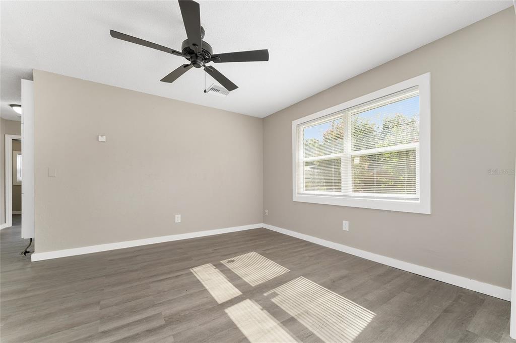 919 Southeast 19th Street Gainesville, FL 32641 - Photo 16 of 50 a view of an empty room with a window