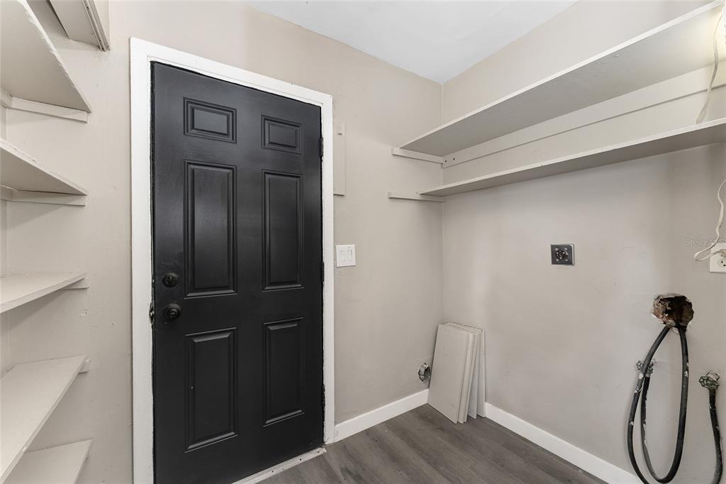 919 Southeast 19th Street Gainesville, FL 32641 - Photo 28 of 50 a view of a hallway with wooden floor