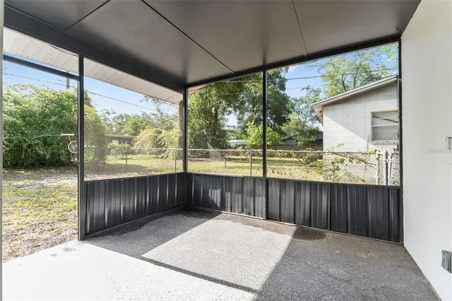 a view of a porch with wooden floor