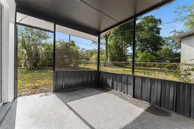 a view of a porch with wooden floor and outdoor space