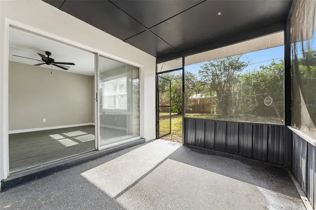 a view of a porch with wooden floor and outdoor space