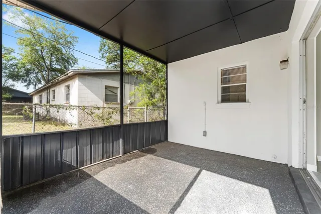 a view of backyard with large tree