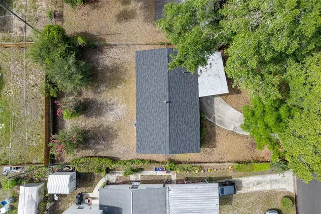 an aerial view of a house with outdoor space