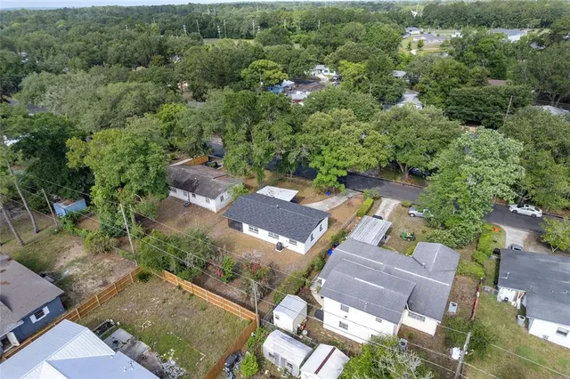 an aerial view of residential house with outdoor space
