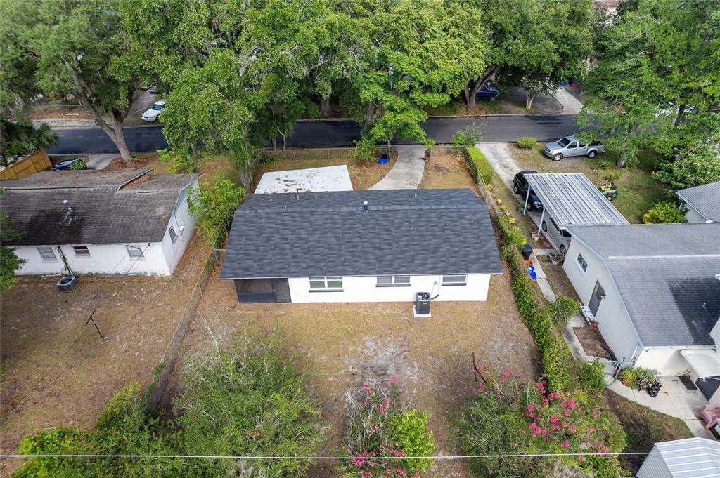 919 Southeast 19th Street Gainesville, FL 32641 - Photo 49 of 50 an aerial view of a house with swimming pool and big yard
