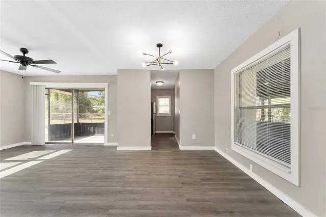 a view of an empty room with glass door