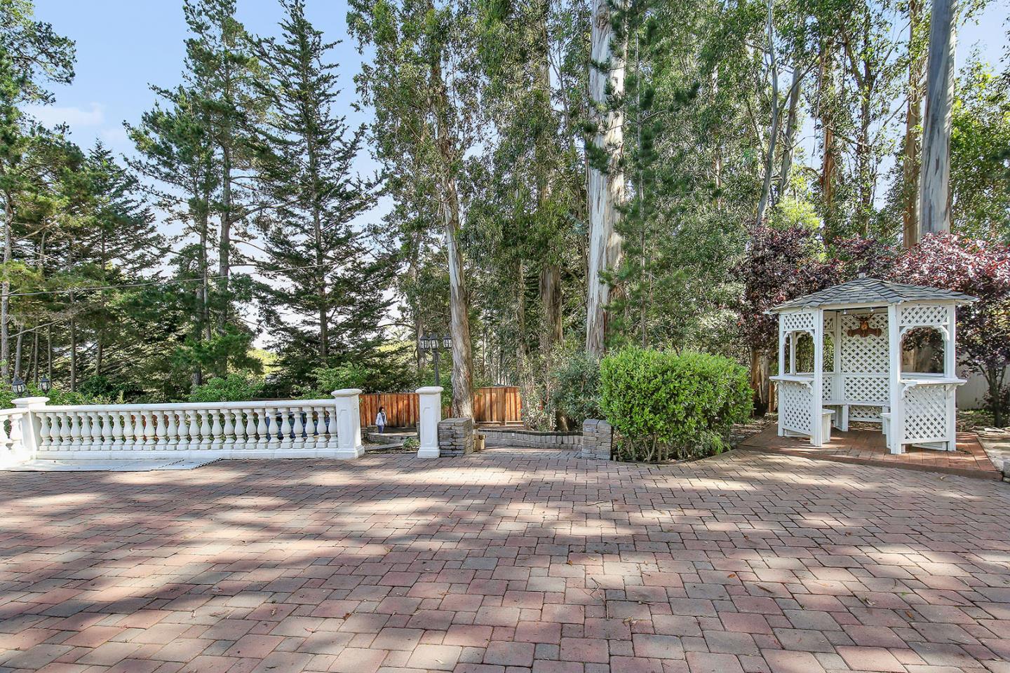 535 Darrell Road Hillsborough, CA 94010 - Photo 63 of 102 a front view of a house with a garden