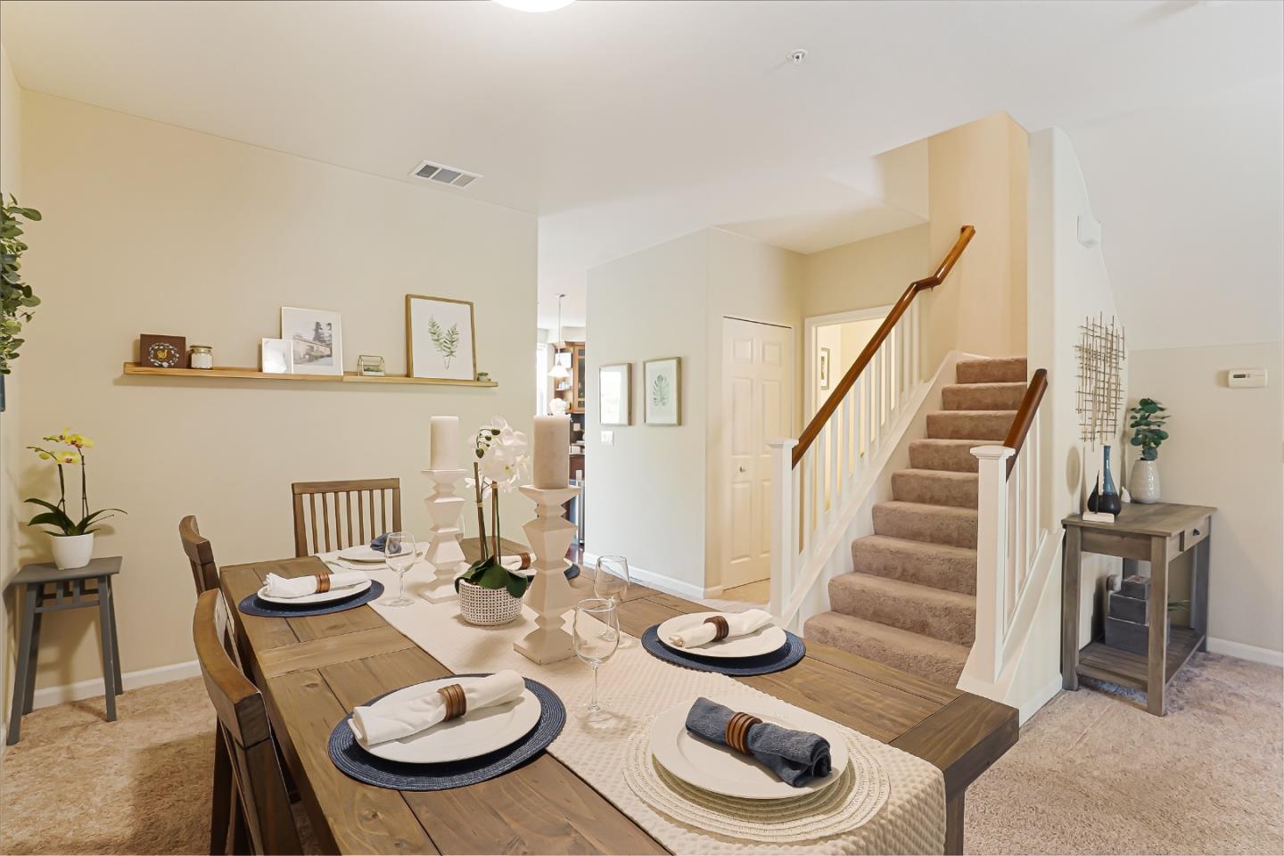 109 Esfahan Drive San Jose, CA 95111 - Photo 12 of 44 a view of a dining room and kitchen with furniture wooden floor and a rug