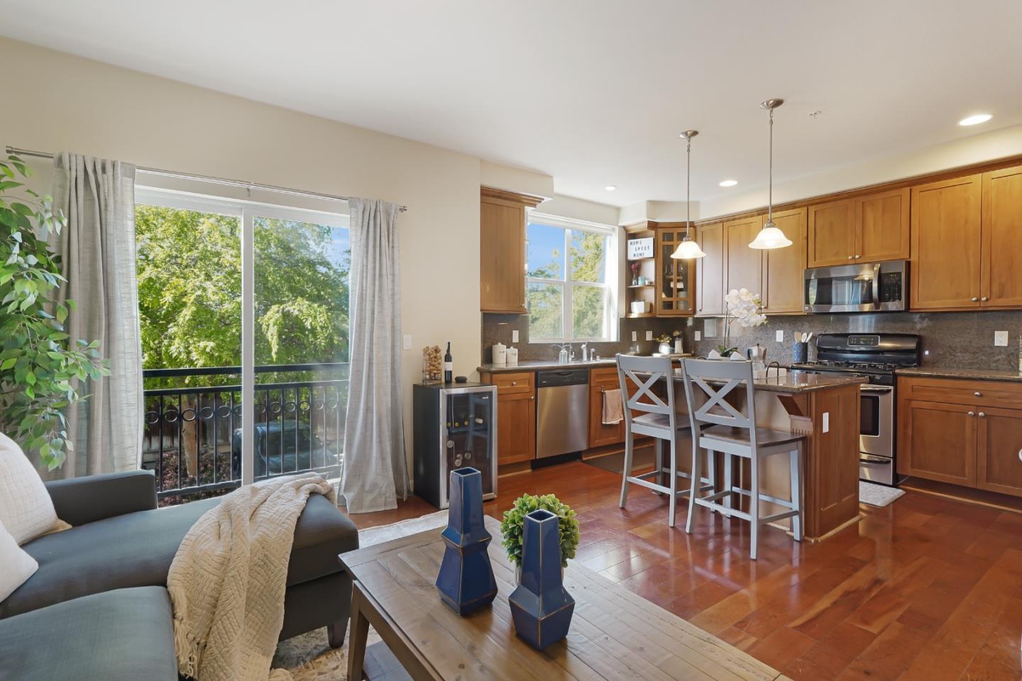 109 Esfahan Drive San Jose, CA 95111 - Photo 17 of 44 a living room with stainless steel appliances furniture a large window and a kitchen view