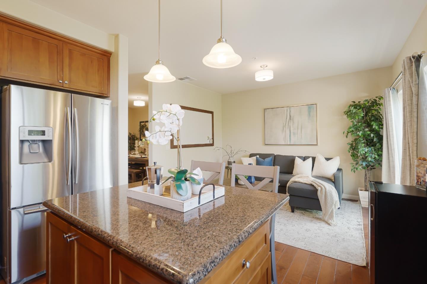 109 Esfahan Drive San Jose, CA 95111 - Photo 18 of 44 a kitchen with granite countertop cabinets and a refrigerator