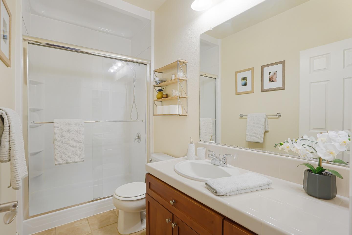 109 Esfahan Drive San Jose, CA 95111 - Photo 27 of 44 a bathroom with a granite countertop sink a toilet and shower