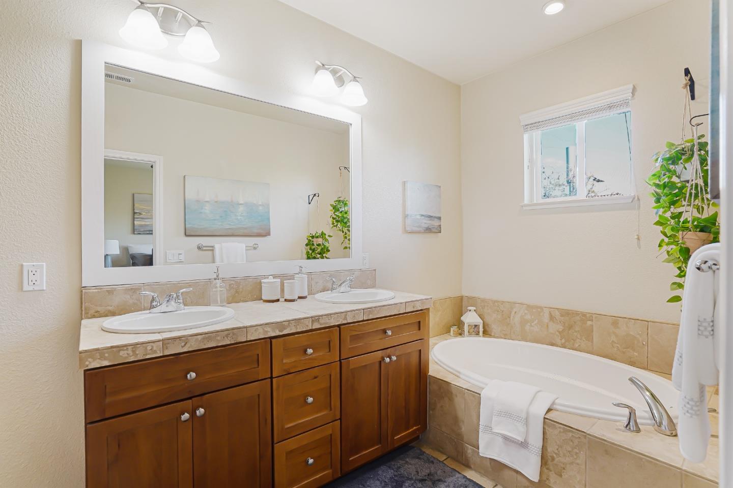 109 Esfahan Drive San Jose, CA 95111 - Photo 28 of 44 a bathroom with a granite countertop sink a large mirror a toilet and a bathtub