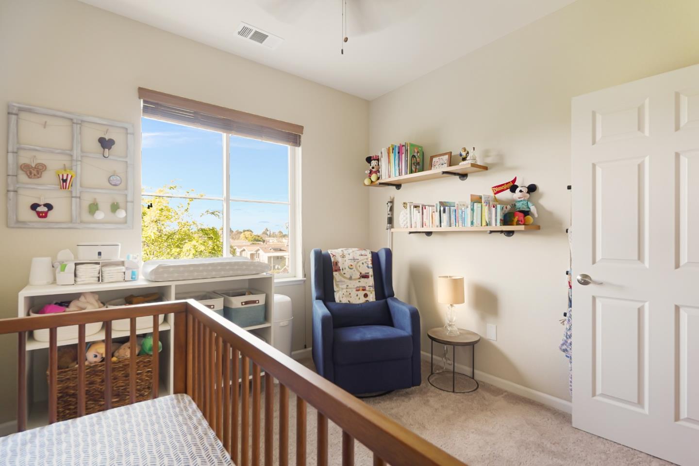 109 Esfahan Drive San Jose, CA 95111 - Photo 31 of 44 a hallway with a baby crib with wooden floor and furniture