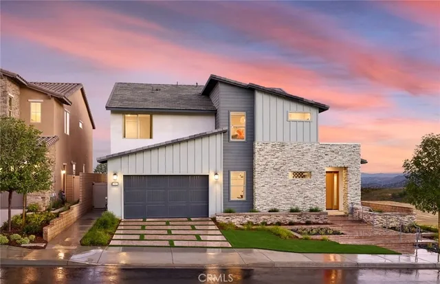 a front view of a house with yard