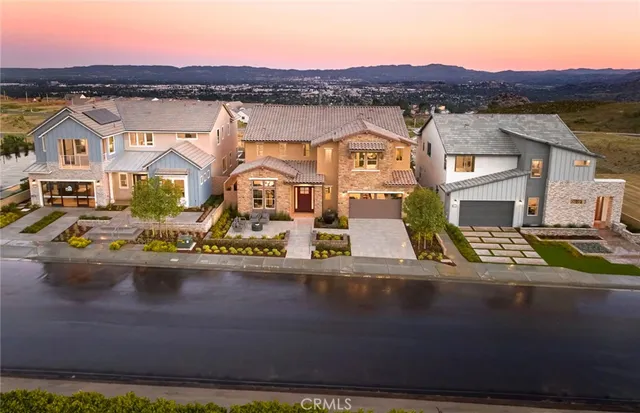 an aerial view of residential houses and outdoor space