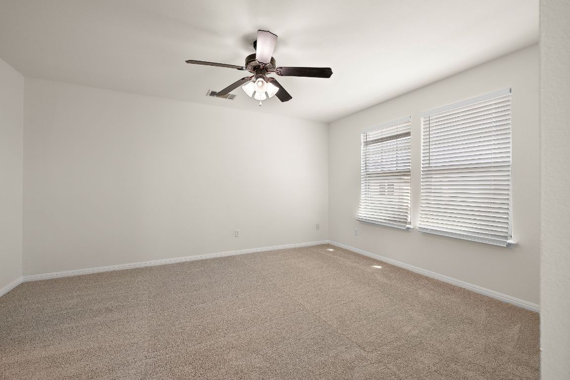 4602 Kind Way, Unit 287 Austin, TX 78725 - Photo 14 of 25 a view of an empty room with a window
