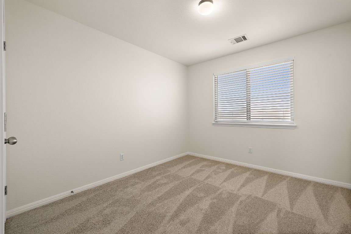 4602 Kind Way, Unit 287 Austin, TX 78725 - Photo 17 of 25 an empty room with a window