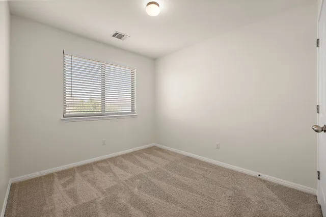 a bathroom with a sink a toilet a mirror and shower