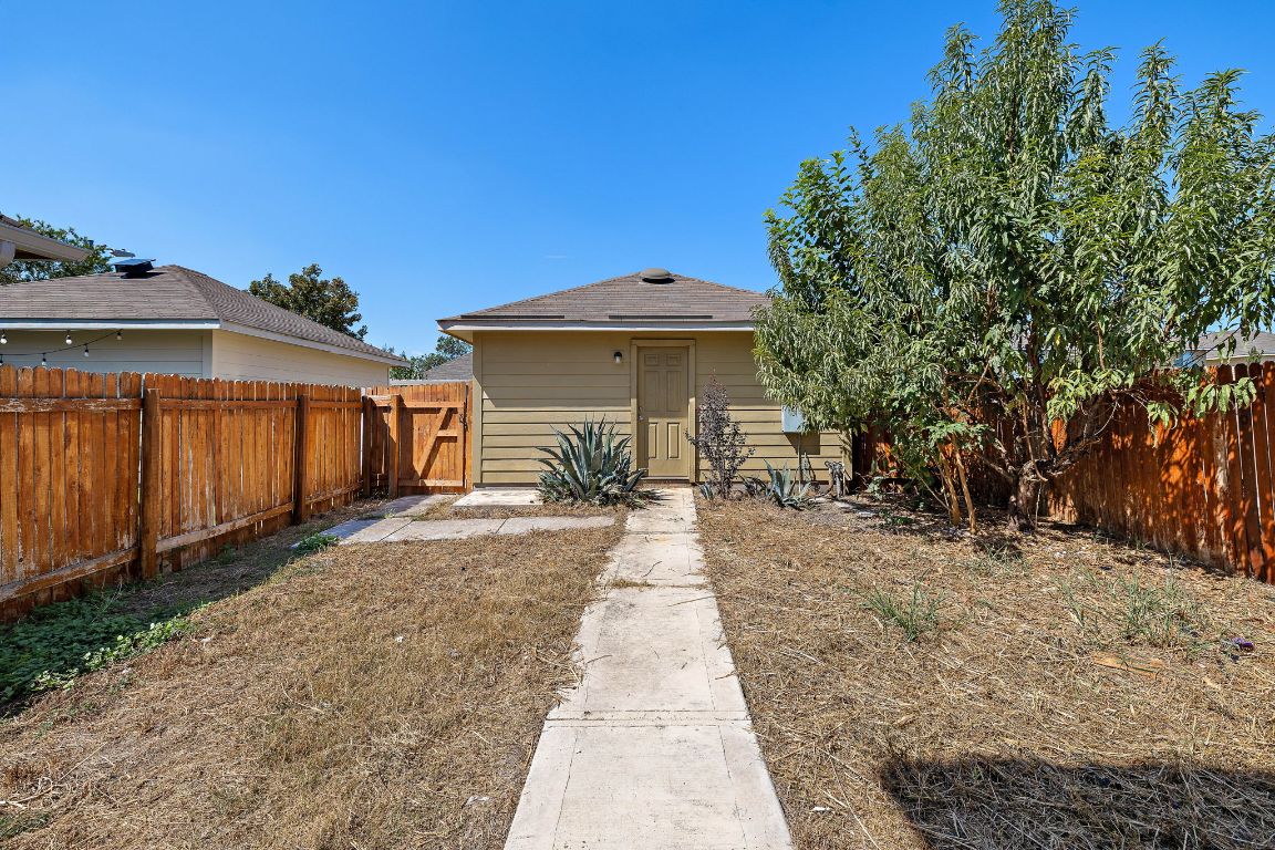 4602 Kind Way, Unit 287 Austin, TX 78725 - Photo 20 of 25 a view of a house with backyard