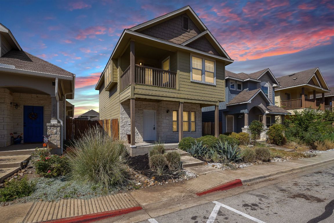 4602 Kind Way, Unit 287 Austin, TX 78725 - Photo 2 of 25 a front view of a house with garden