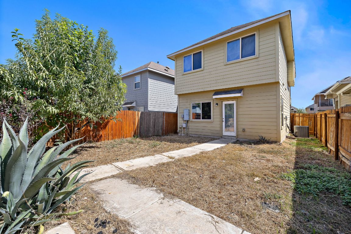 4602 Kind Way, Unit 287 Austin, TX 78725 - Photo 21 of 25 a view of a house with a yard