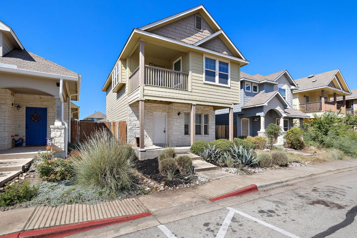 4602 Kind Way, Unit 287 Austin, TX 78725 - Photo 3 of 25 a front view of a house with a yard