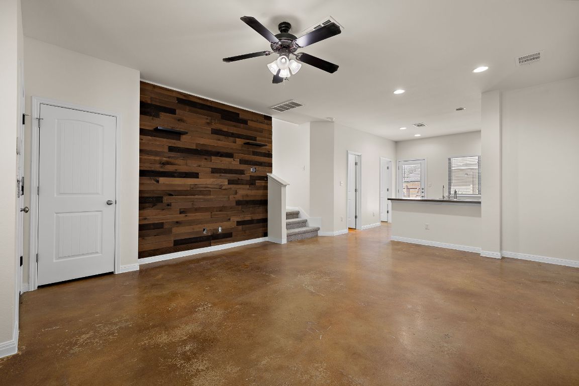 4602 Kind Way, Unit 287 Austin, TX 78725 - Photo 5 of 25 a view of an empty room with a ceiling fan