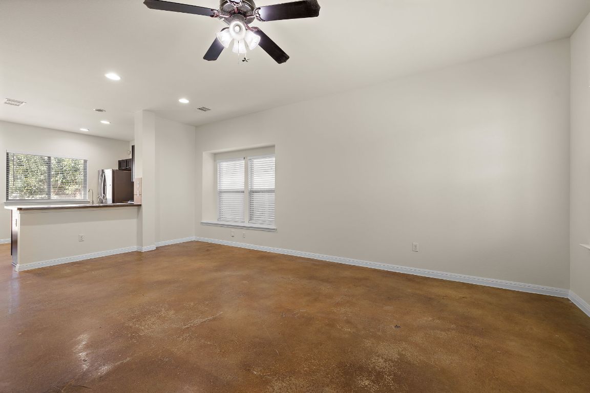 4602 Kind Way, Unit 287 Austin, TX 78725 - Photo 6 of 25 a view of an empty room with a window
