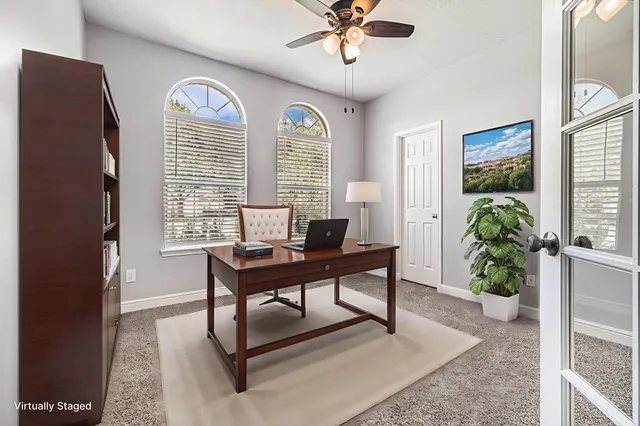a view of a livingroom with furniture and a window