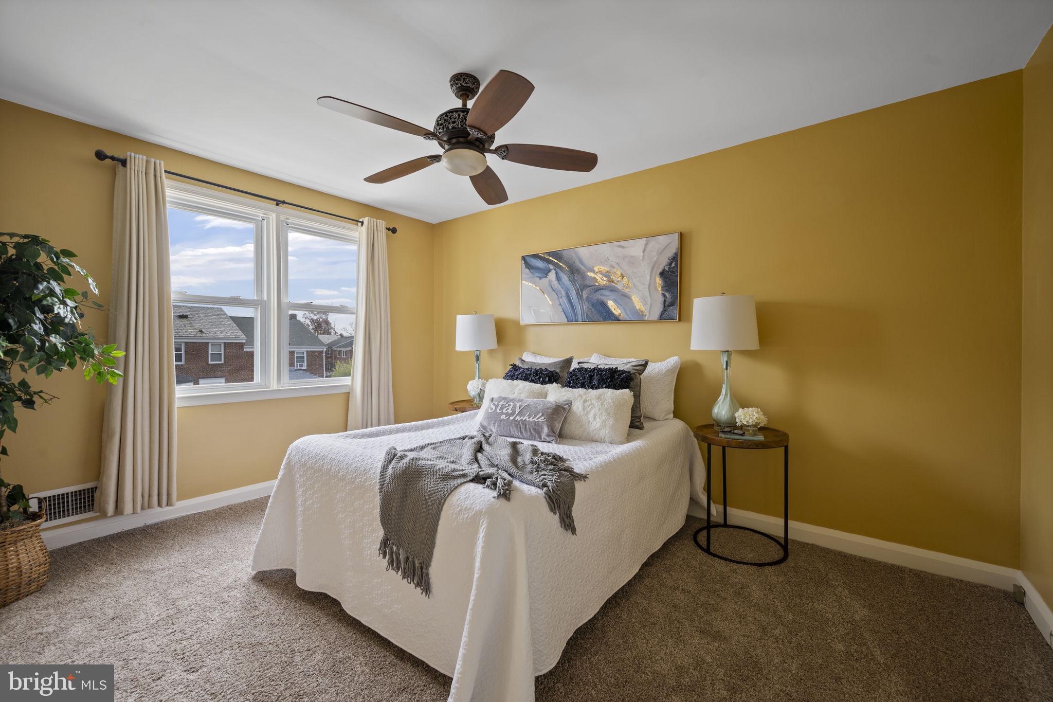 36 Darrow Drive Baltimore, MD 21228 - Photo 16 of 42 a bedroom with a bed and a large window