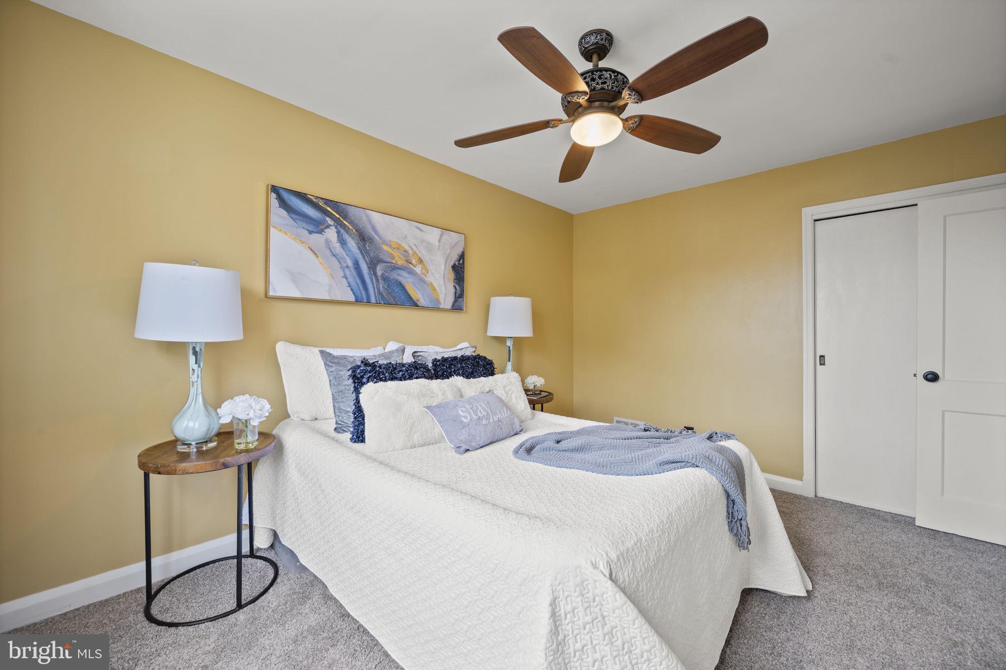 36 Darrow Drive Baltimore, MD 21228 - Photo 17 of 42 a bedroom with a bed and a lamp on table