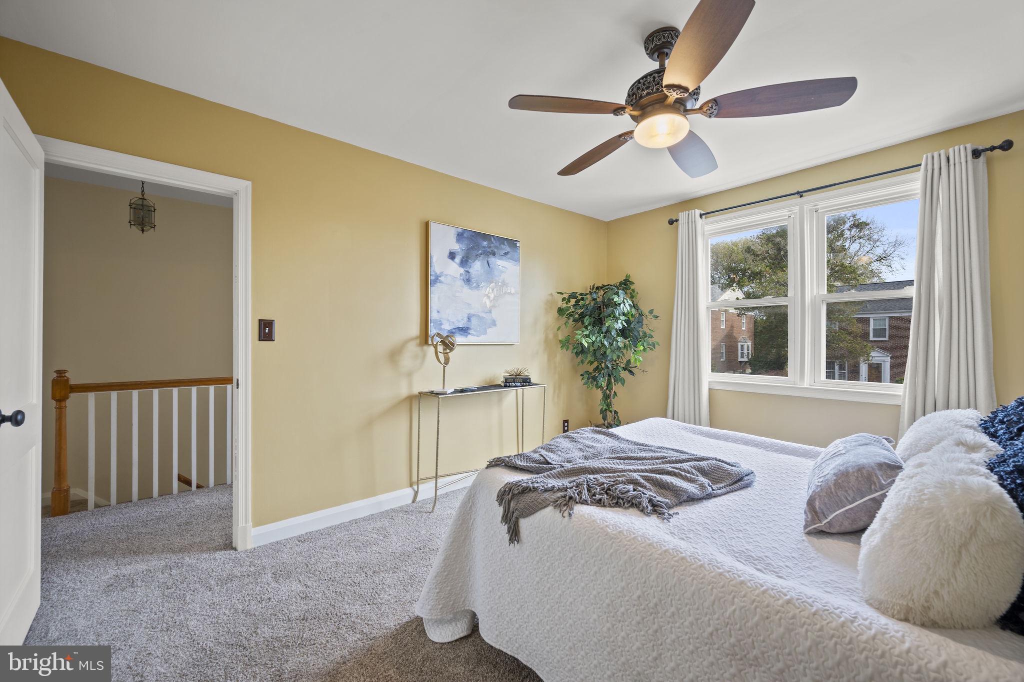 36 Darrow Drive Baltimore, MD 21228 - Photo 18 of 42 a living room with a bed furniture chandelier and a large window