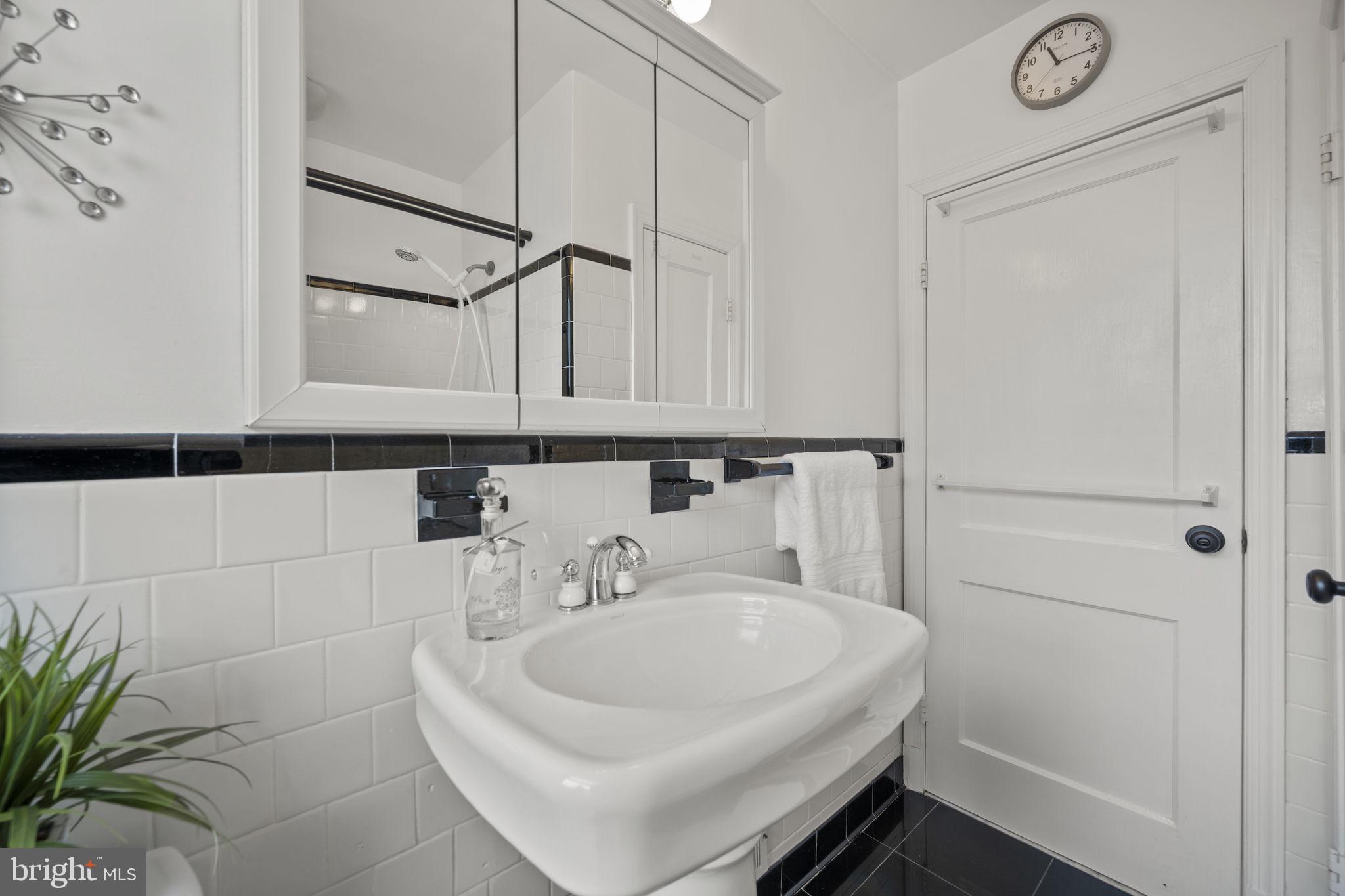 36 Darrow Drive Baltimore, MD 21228 - Photo 20 of 42 a bathroom with a sink and a mirror