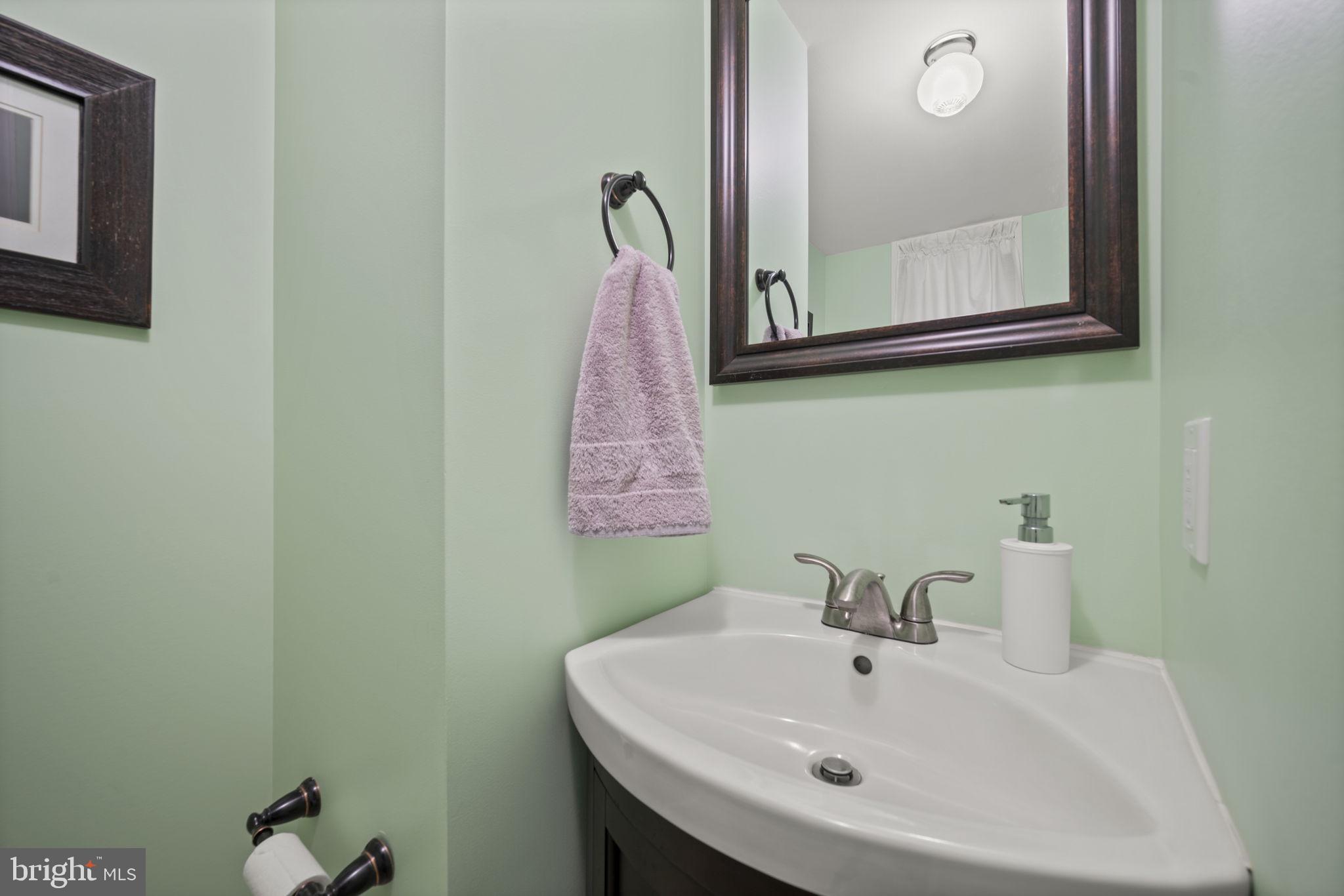 36 Darrow Drive Baltimore, MD 21228 - Photo 31 of 42 a bathroom with a sink and a mirror