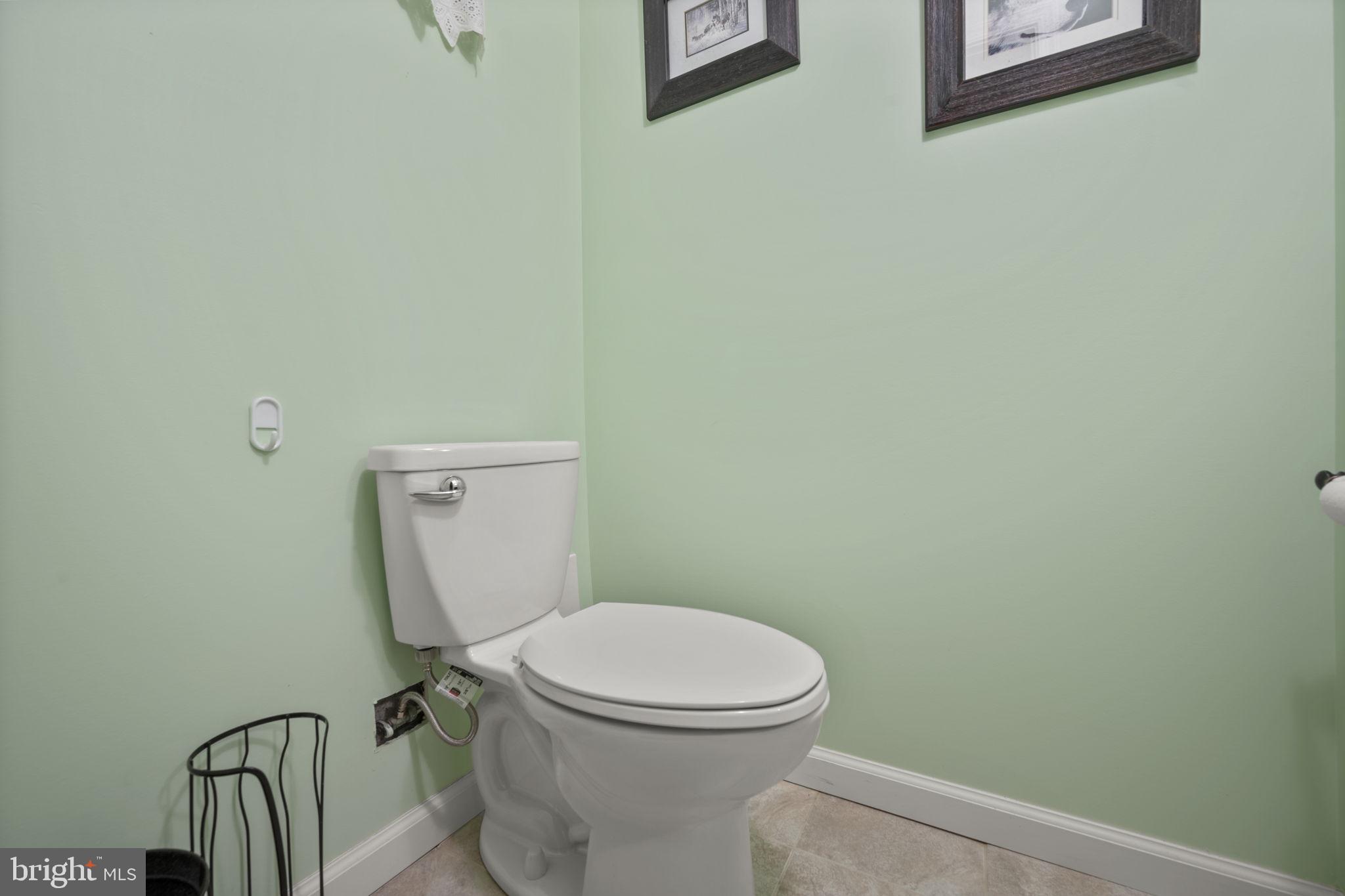 36 Darrow Drive Baltimore, MD 21228 - Photo 32 of 42 a white toilet sitting next to a white wall