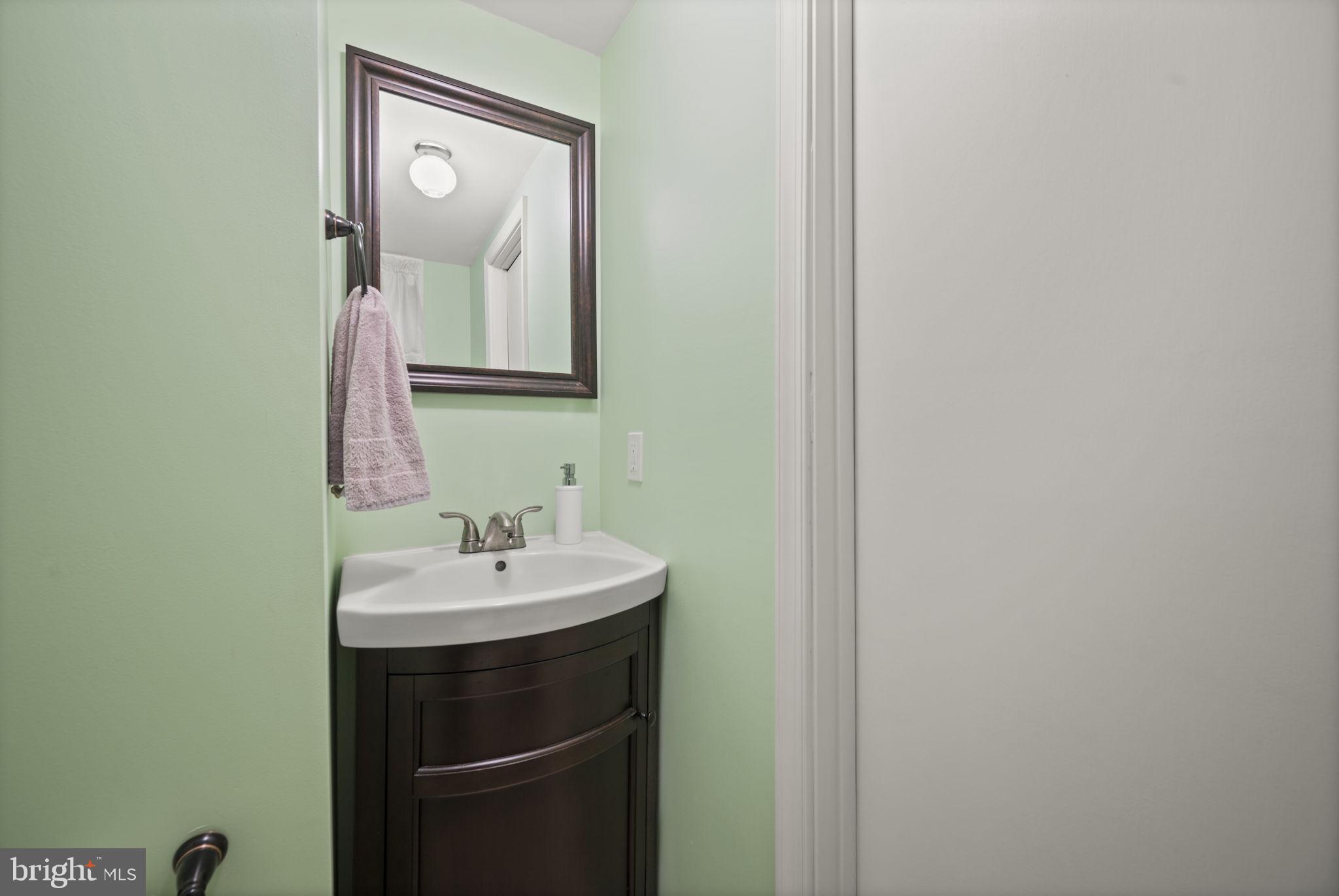 36 Darrow Drive Baltimore, MD 21228 - Photo 33 of 42 a bathroom with a sink and a mirror