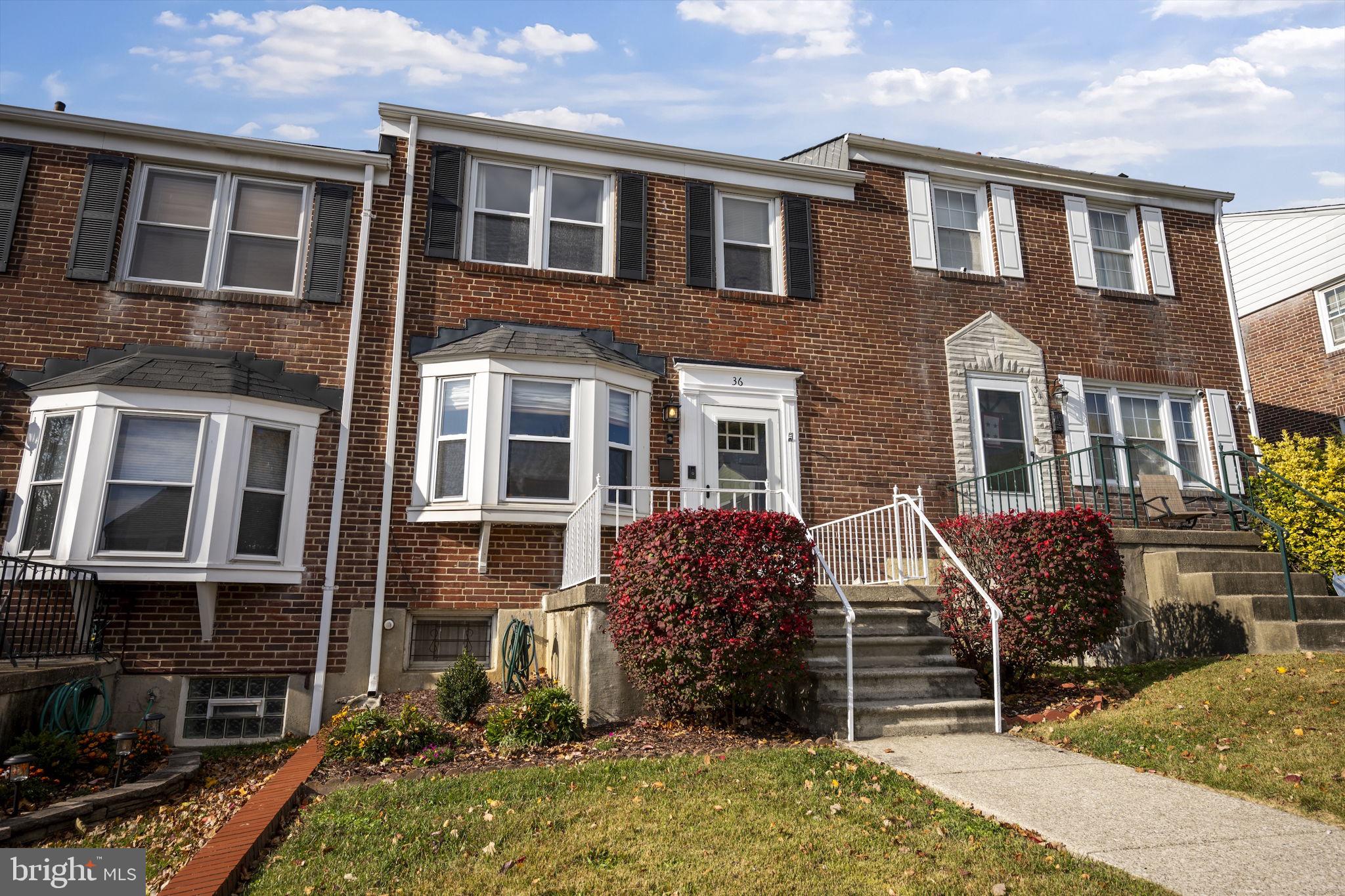 36 Darrow Drive Baltimore, MD 21228 - Photo 40 of 42 a front view of a house with a yard