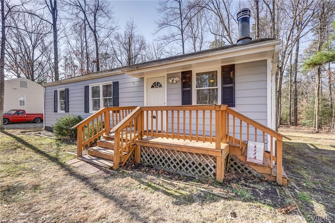 412 Queensway Road Chesterfield, VA 23236 - Photo 20 of 39 a view of a house with a yard and wooden fence