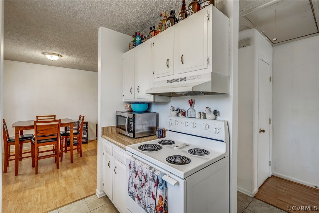 412 Queensway Road Chesterfield, VA 23236 - Photo 33 of 39 a kitchen with a stove and white cabinets