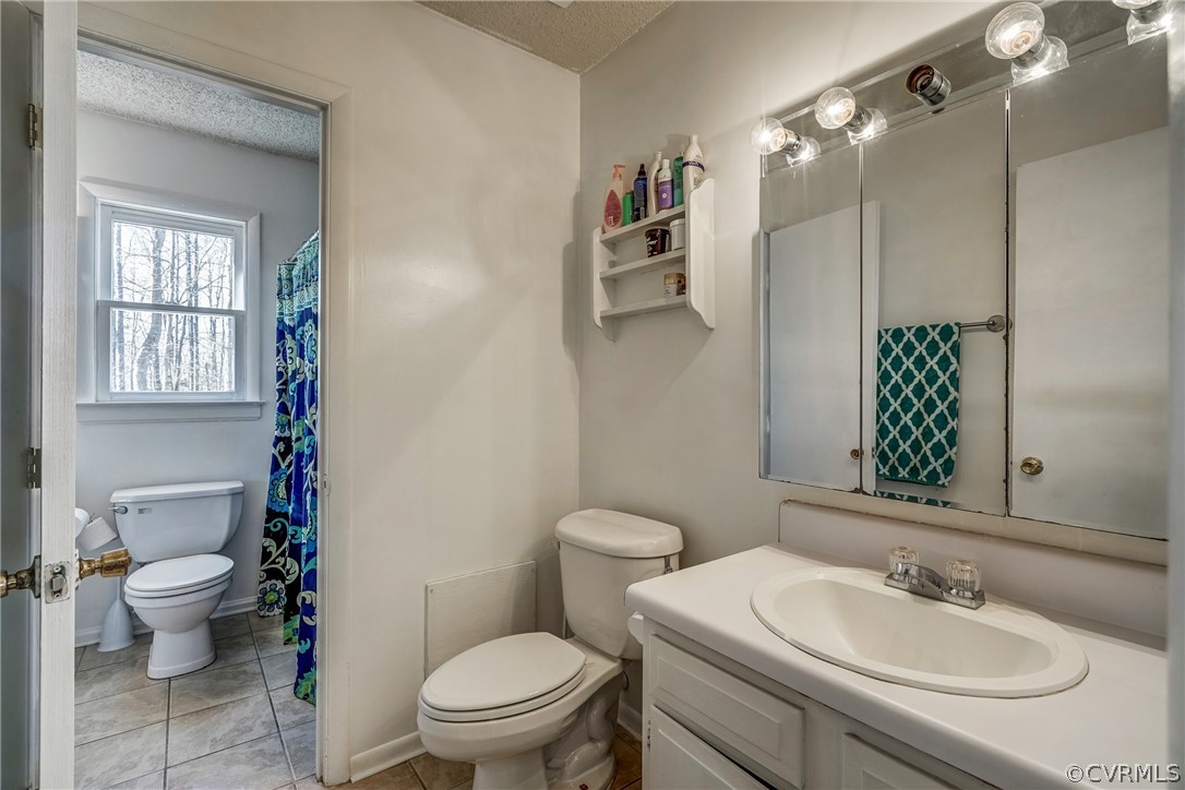 412 Queensway Road Chesterfield, VA 23236 - Photo 35 of 39 a bathroom with a sink toilet and shower