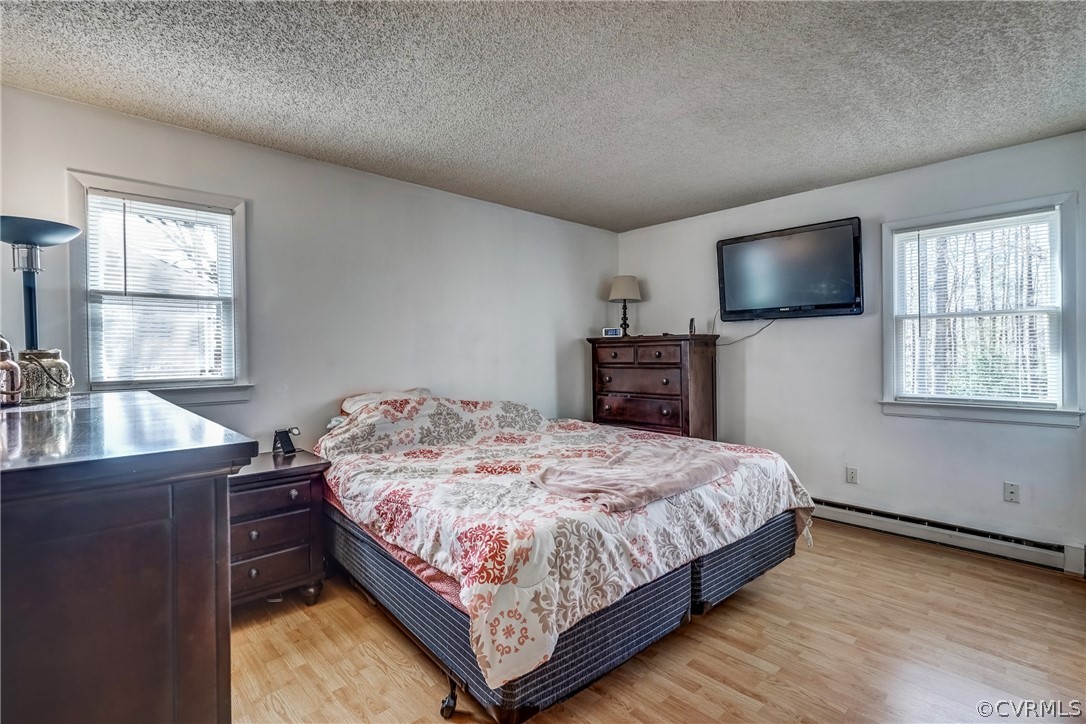 412 Queensway Road Chesterfield, VA 23236 - Photo 37 of 39 a bedroom with a bed and a flat screen tv