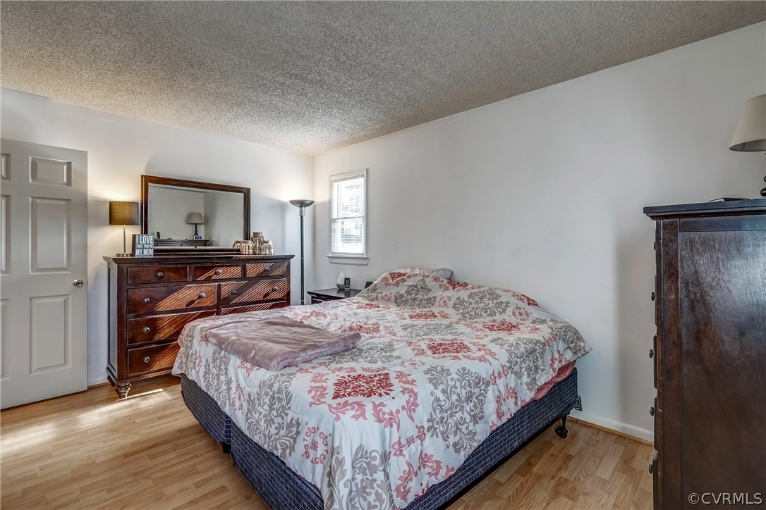 412 Queensway Road Chesterfield, VA 23236 - Photo 38 of 39 a bedroom with a bed and dresser
