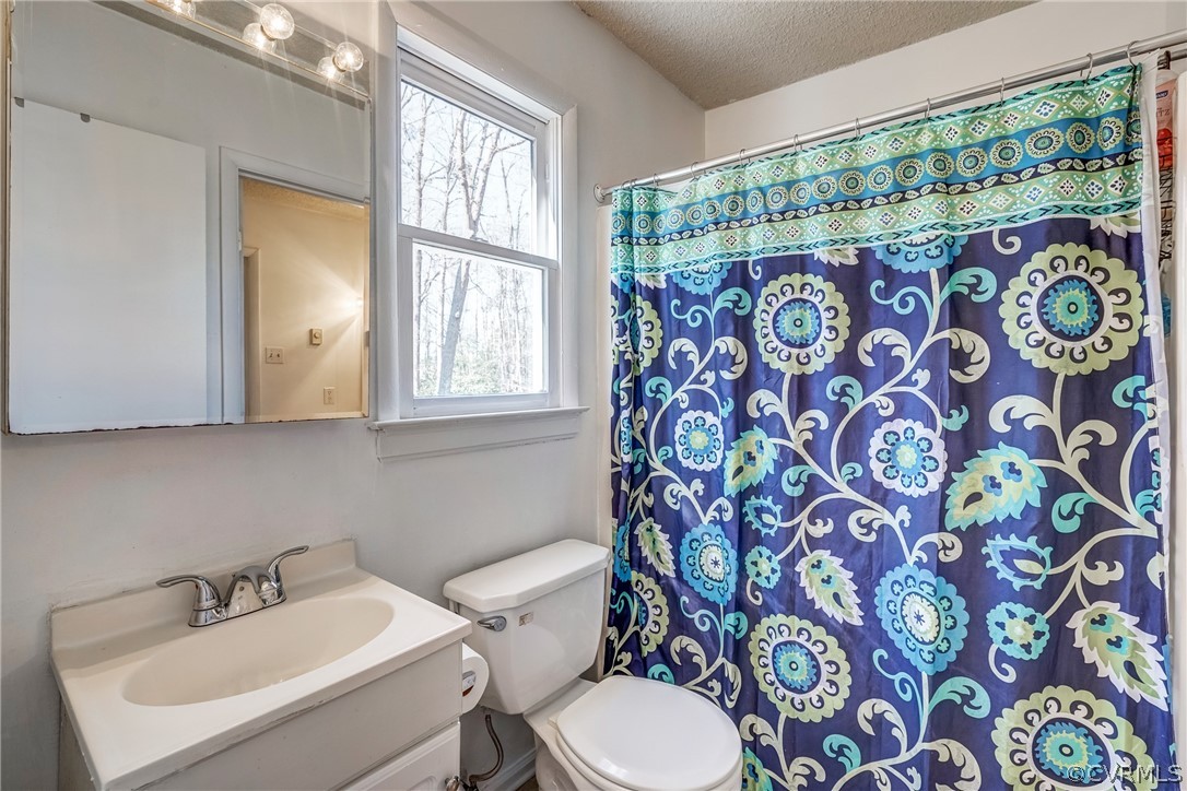 412 Queensway Road Chesterfield, VA 23236 - Photo 39 of 39 a bathroom with a sink and mirror with toilet