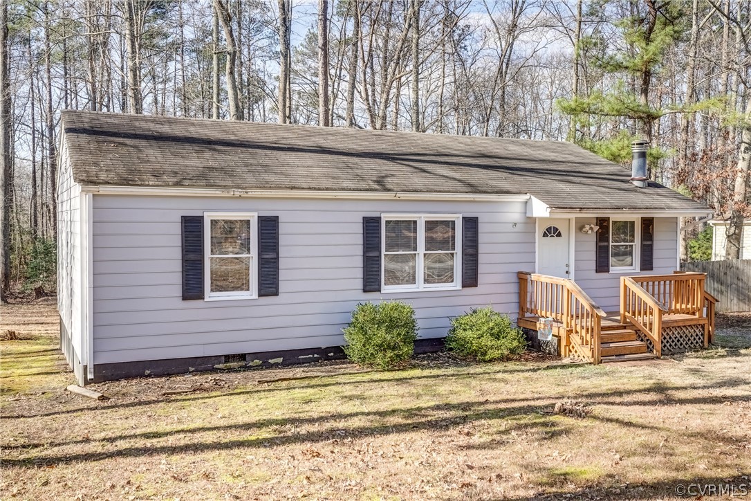 412 Queensway Road Chesterfield, VA 23236 - Photo 4 of 39 a front view of a house with a garden and plants