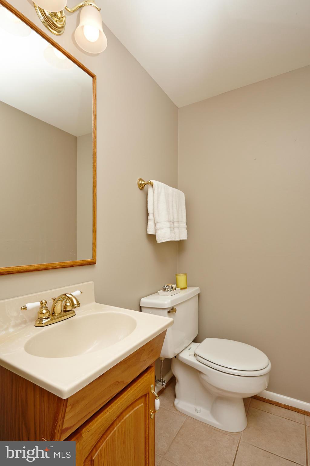 1426 Yellowwood Court Reston, VA 20190 - Photo 13 of 30 a bathroom with a toilet a sink and mirror
