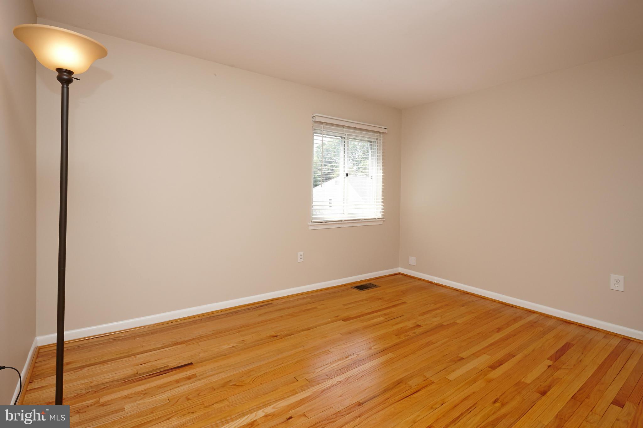 1426 Yellowwood Court Reston, VA 20190 - Photo 14 of 30 a view of an empty room with a window and a chandelier